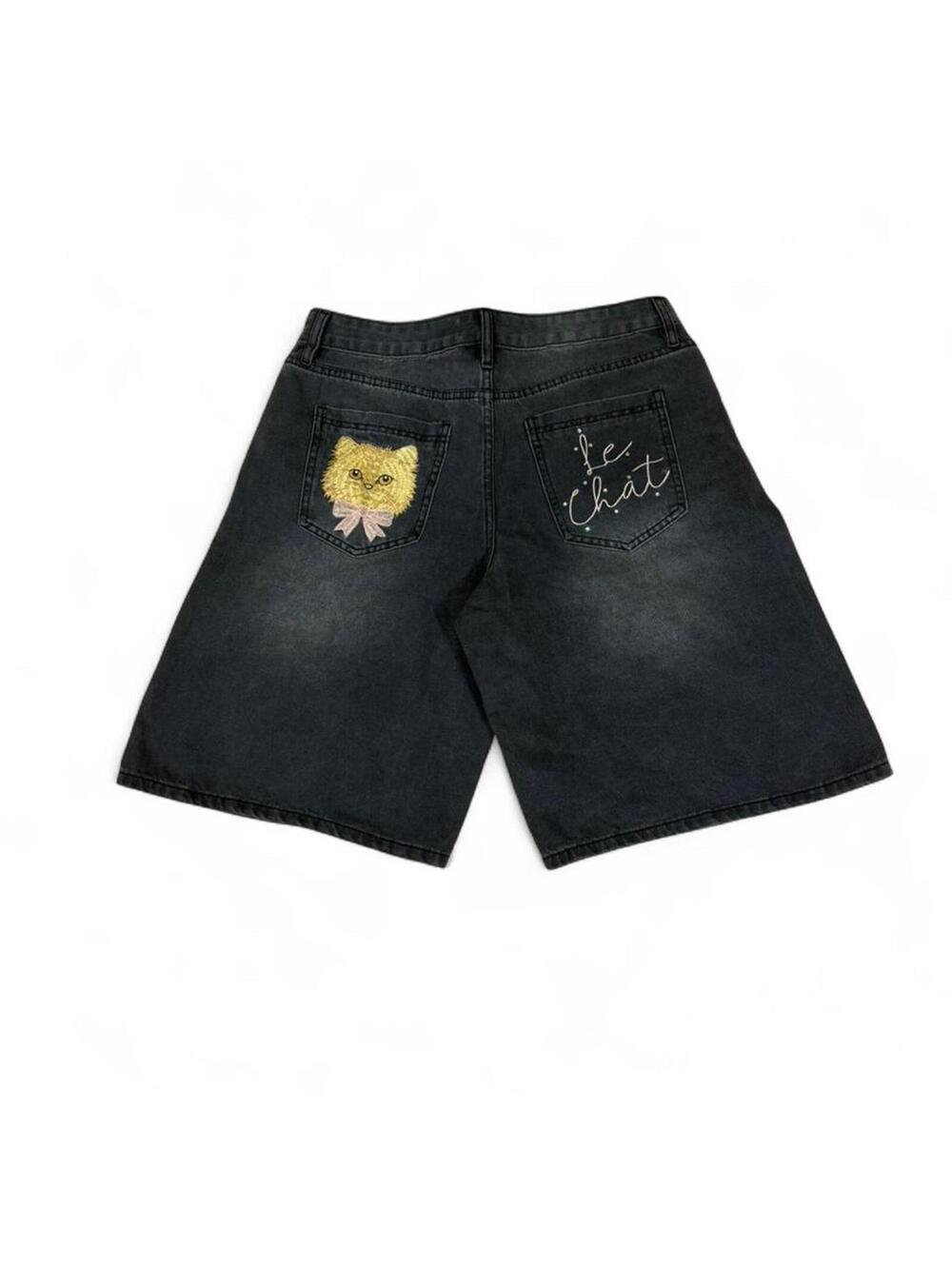 Black denim shorts with embroidered cat design
